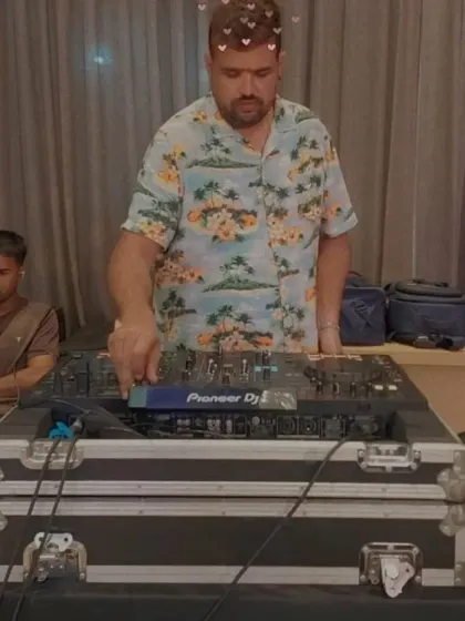 A fun, stylized shot of me mixing tracks. It's all about creating a fun and memorable experience for the wedding guests.