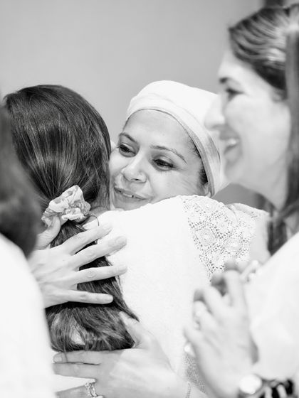 A heartfelt hug after a session. Our community is built on love, support, and deep connection.
