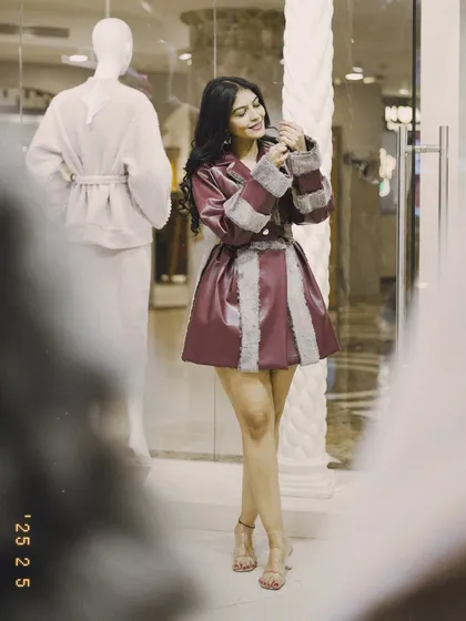 This burgundy faux leather and fur coat is a statement piece for winter. It's perfect for a night out or a special occasion when you want to feel glamorous.