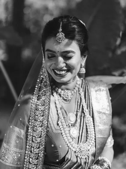 Another artistic black and white shot, this time capturing her joyful smile. Even without color, you can see the radiance and flawless finish of her bridal makeup.