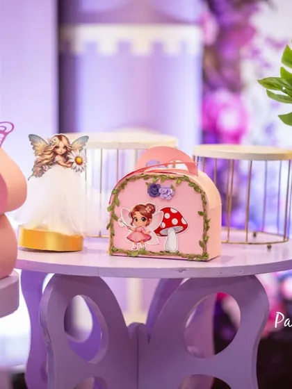 Every little detail matters in creating an immersive theme. For this fairy garden party, I designed custom table centerpieces with miniature fairy houses, mushroom props, and butterfly accents.