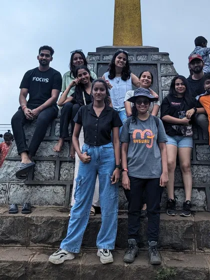 The group posing at another landmark, capturing memories of their trip.