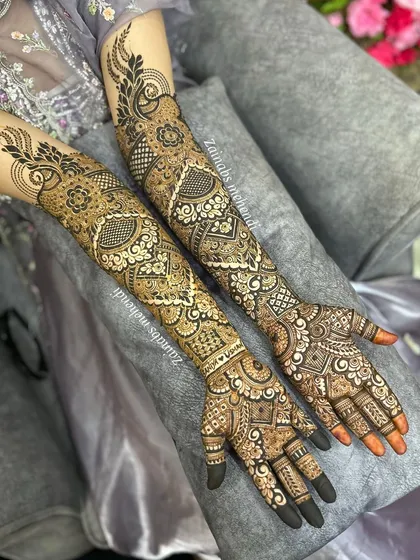 A beautiful shot of Saniya's full bridal henna on both arms, showcasing the symmetry and intricate details.