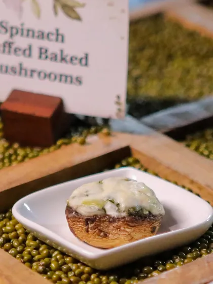 Spinach and cheese stuffed baked mushrooms. This classic appetizer is always a crowd-pleaser, served hot and bubbling from the oven.