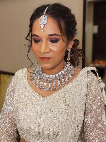 A full view of the sangeet glam look. The dramatic eye makeup and textured updo are perfect for a night of dancing and celebration.