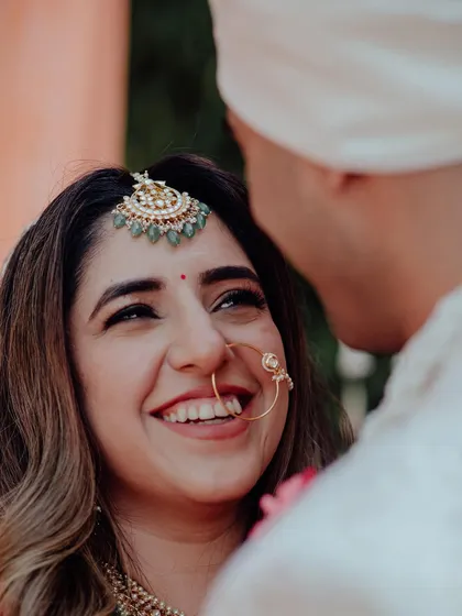 The look of love. A close-up of the bride's face, her eyes filled with adoration as she looks at her groom.