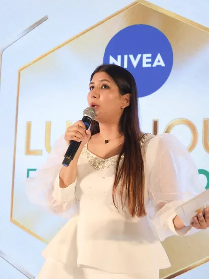 A candid close-up from the Nivea Luminous Evenglow launch. This shot captures me in my element, speaking passionately about the product and connecting with the audience.