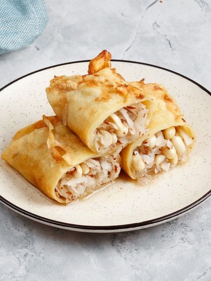 A unique sweet treat, our fried rolls are filled with a mixture of coconut and nuts. They offer a delightful crunch and sweet finish to your meal.