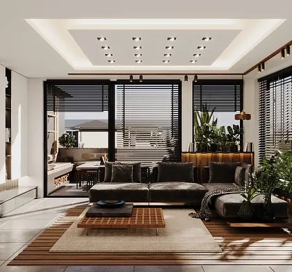 This view showcases the living area of the sunroom, with a focus on the built-in shelving and entertainment console. The design maintains a connection to the outdoors through the large, louvered windows.