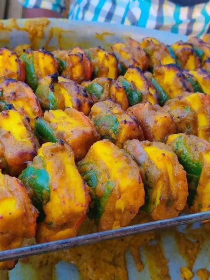 A close-up of our delicious paneer tikka, marinated and grilled to perfection. This is a popular appetizer choice for our live tandoor and buffet menus.