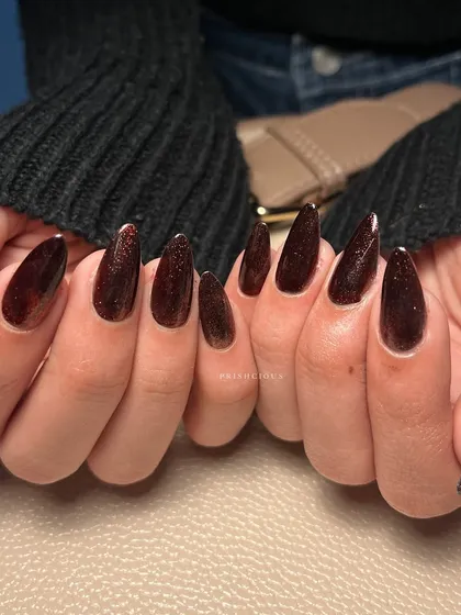 A close-up of the rich, chocolatey brown cat eye polish. The magnetic glitter creates so much depth and dimension.