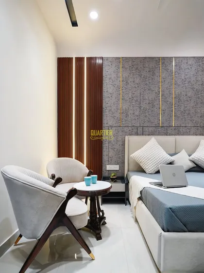 This shot highlights the cozy seating nook I created in the parents' bedroom. The two elegant armchairs and small coffee table provide a perfect spot for morning tea or quiet conversation.