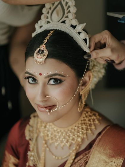 A beautiful, smiling portrait of Archita. Her happiness and confidence shine, bringing the entire traditional look to life.