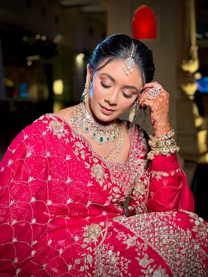 A serene close-up of the bride. This shot highlights the smooth, airbrushed finish of the skin and the delicate shimmer on the eyelids.