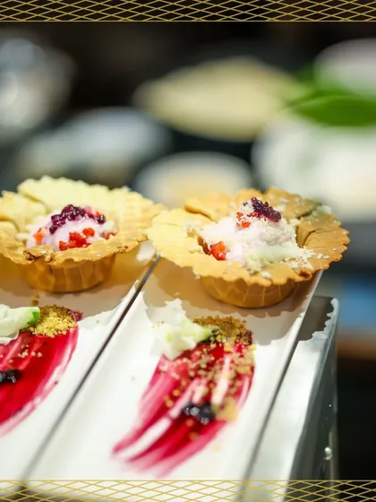 A closer look at our waffle tarts and deconstructed berry desserts. The artistic smear of berry coulis on the plate adds a touch of modern culinary art.