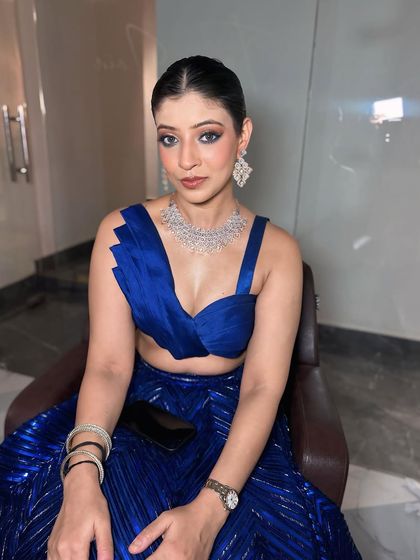 Another angle of this beautiful blue look. The makeup is designed to look good from every angle, ensuring you are picture-perfect all night.