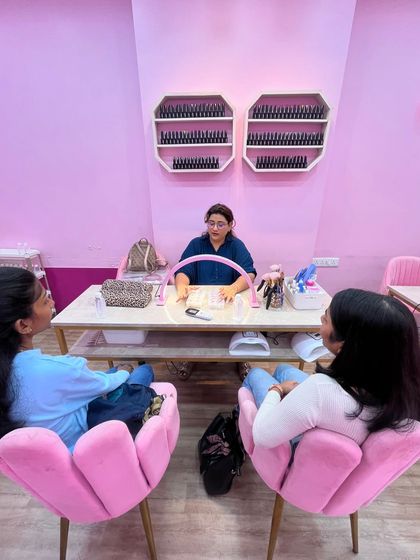 Here I am, explaining the fundamentals of press-on nail creation to my students. The learning environment is interactive and friendly, ensuring everyone feels comfortable asking questions and mastering the techniques.