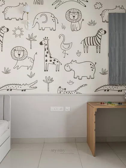 A corner of the kid's room showing the adjustable study desk and the fun animal-themed wallpaper. The design is both playful and practical, creating a space that can grow with the child.