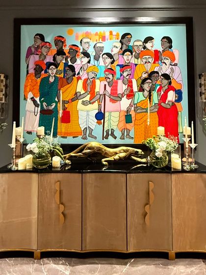 Even the existing art in a home can be part of the decor. For this birthday, our simple yet elegant floral arrangements on the console table complemented the vibrant painting above it.