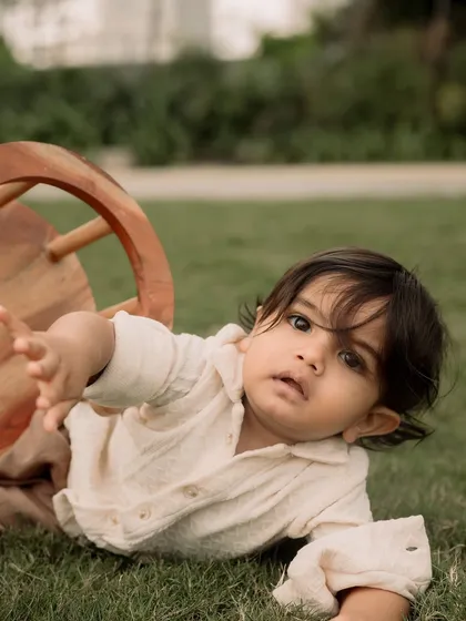 A playful moment on the grass. I let kids be kids during my outdoor sessions to capture their true personalities.