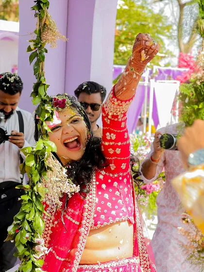 The bride's triumphant and joyous scream during her Haldi ceremony. It's these unfiltered expressions of happiness that I work to create and capture.
