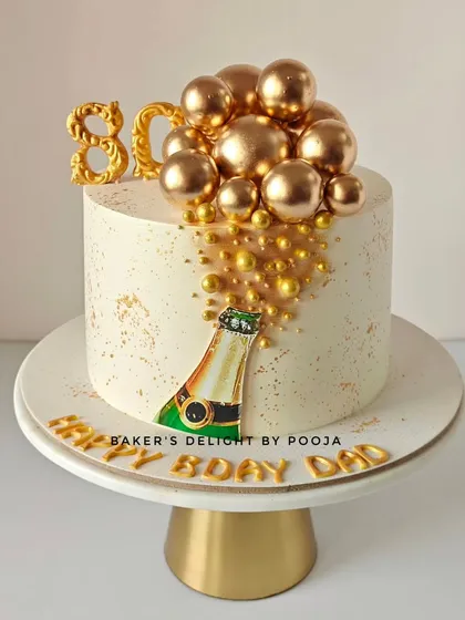 Cheers to 80 amazing years! This elegant champagne bottle cake features a hand-painted bottle with golden bubbles cascading down the side, perfect for a milestone celebration.