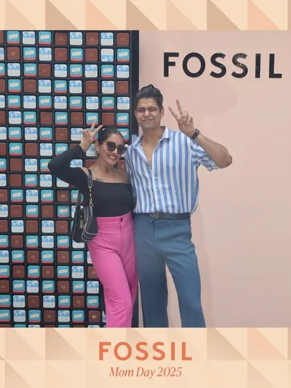 A happy couple enjoying the Fossil Mother's Day event. Our photo booth is an engaging activity for all attendees, whether they come alone or with a partner.
