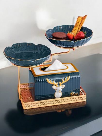 This clever piece combines a tissue box holder with two small serving bowls on top. It's a highly functional and stylish accessory for your coffee table, perfect for hosting guests.