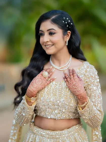 A candid moment of the bride, her hair and makeup looking effortlessly beautiful.