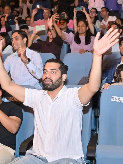 The energy from the audience was incredible. Here I am, cheering right back at them from the crowd, feeling just as excited as they are.
