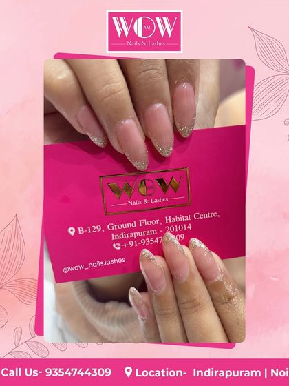 A subtle yet sparkling design on almond-shaped extensions. This look features a sheer nude base with a delicate dusting of gold glitter at the tips for a touch of glamour.