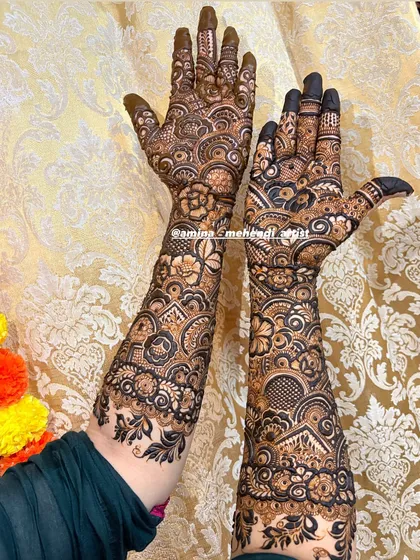 The back of a full bridal design, showing how the pattern flows beautifully from the wrist up the arm.