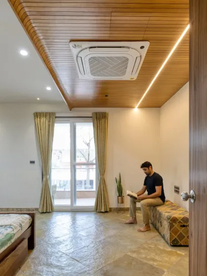 The room is designed to be a calm space for relaxation, with plenty of natural light and minimal, thoughtful styling.