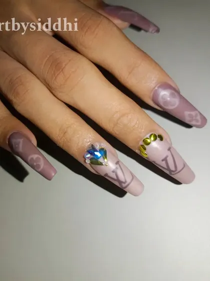 A still shot of the chic and trendy Louis Vuitton inspired nail art.