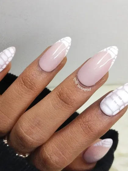 A close-up of the white croc-print stick-on nails. The texture is created by hand to mimic the look and feel of a crocodile pattern.