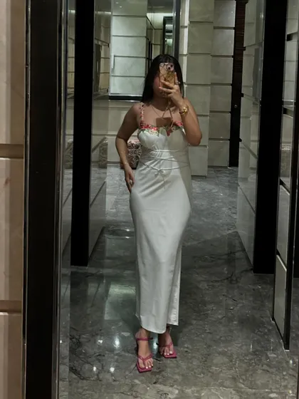 An elevator mirror shot capturing the complete elegant look.