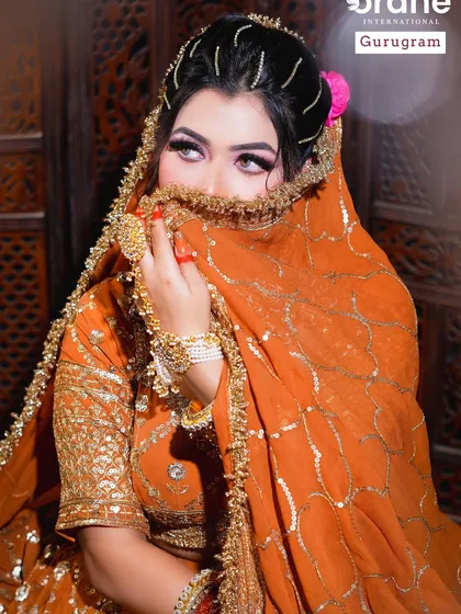 The classic bridal veil shot, highlighting the eyes and makeup. I teach my students how to ensure the makeup looks stunning even when partially covered, a common scenario in Indian weddings.