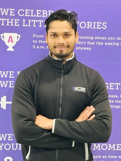 A professional headshot in my Anytime Fitness trainer jacket.
