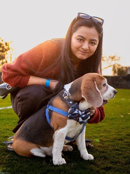 A proud pet parent posing with her beagle. My events provide a wonderful opportunity for owners to bond with their pets and meet other dog lovers.