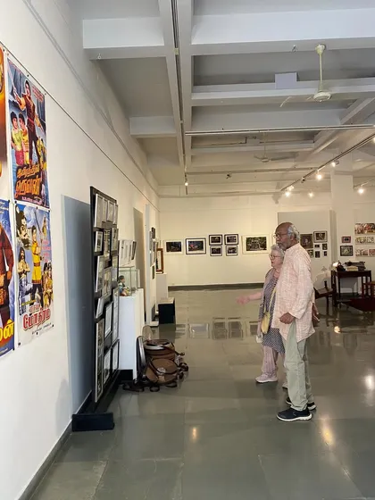Balan Nambiar viewing the vintage movie posters on display.