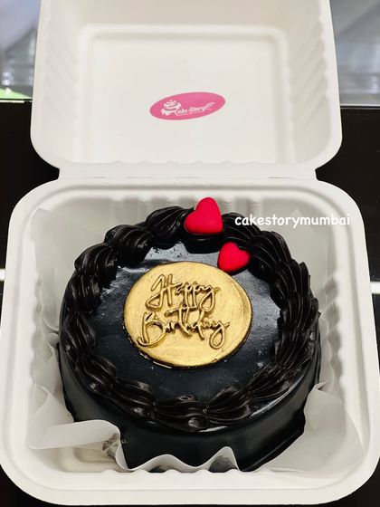 A classic and elegant Happy Birthday bento cake. This rich, dark chocolate cake is simply decorated with a golden "Happy Birthday" plaque and two small red hearts.