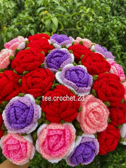 A stunning mixed-color rose bouquet with red, purple, and pink blooms.