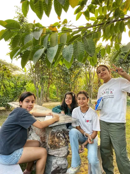 Kids having a great time exploring the farm during a birthday party. There's plenty of space for them to run around and connect with nature.