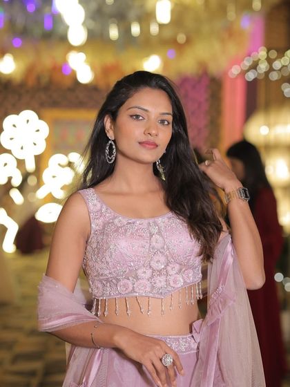 A close-up of the client in the lavender lehenga, highlighting the intricate beadwork on the blouse.