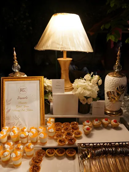 A closer view of our night-time dessert spread. Guests can choose from mango mousse cups, pecan tarts, and mini cheesecakes, all meticulously arranged for a delightful visual and tasting experience.