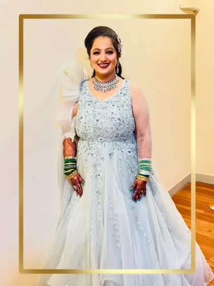 A client looking like a princess in a dreamy ice blue gown, perfect for a reception.