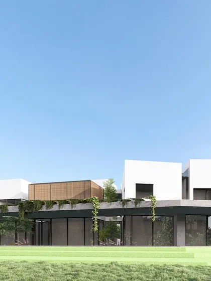 An exterior view of Residence G, showing how the sculptural living units appear to float above the ground-floor verandah. The design extends the landscape across both floors, creating a continuous flow between the built form and the natural environment.
