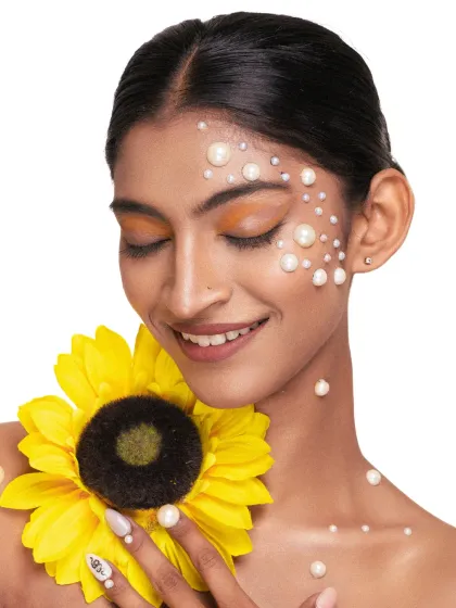 A 'soul-flower' concept, where we combined the radiance of a sunflower with the delicate beauty of pearls. This is a perfect example of a creative beauty portrait.