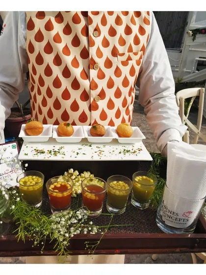 We love to reinvent classic Indian street food with a modern, elegant twist. Here, our server presents our signature golgappas, with flavoured waters served in shot glasses for a fun and sophisticated take on a beloved chaat experience.