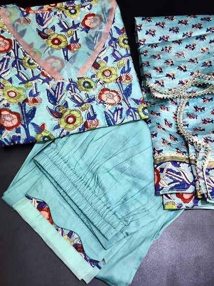 Another beautiful ready-made dress set in a cool blue Chanderi fabric. The Jaipur block print kurti, paired with a matching bottom and dupatta, makes for a refreshing and elegant outfit.